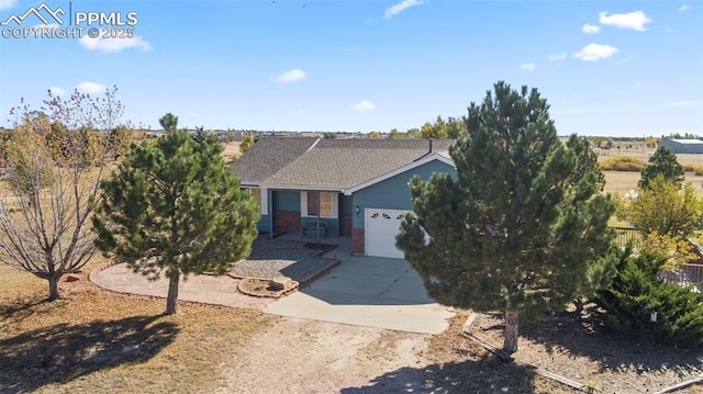 view of front of home with brick siding, driveway, and an attached garage