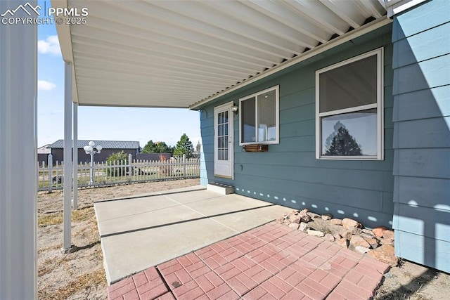 view of patio / terrace featuring fence