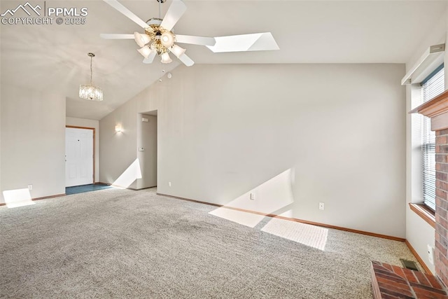 unfurnished living room with lofted ceiling with skylight, visible vents, baseboards, and carpet