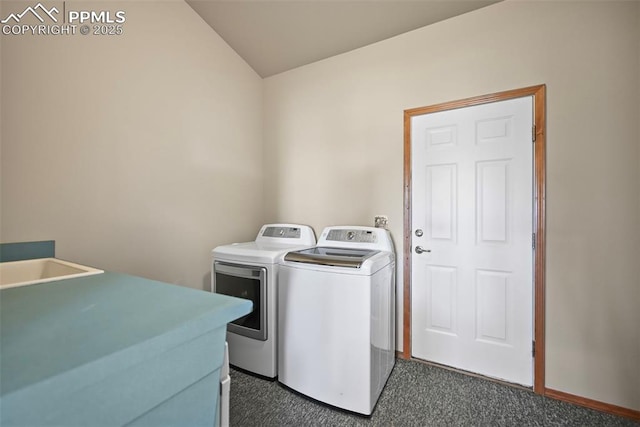 washroom with washer and dryer, laundry area, and dark colored carpet