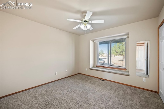 empty room with visible vents, ceiling fan, baseboards, and carpet floors