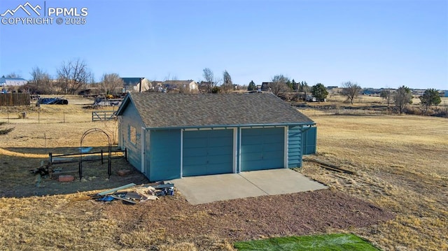 detached garage with fence