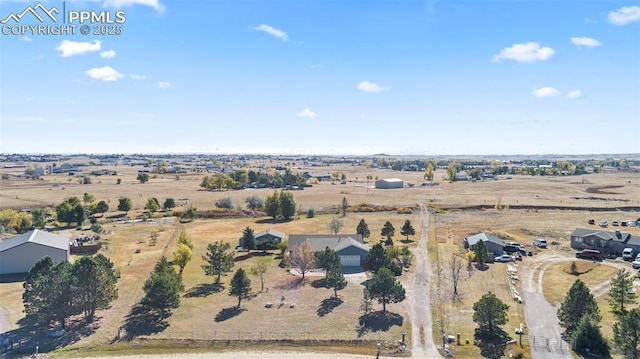 birds eye view of property featuring a rural view