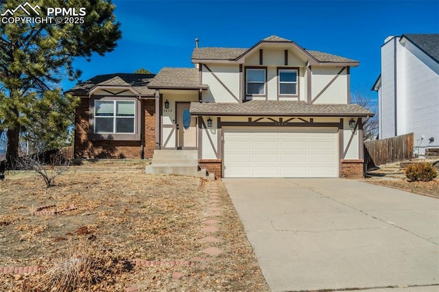 view of front of house featuring brick siding, an attached garage, concrete driveway, and fence