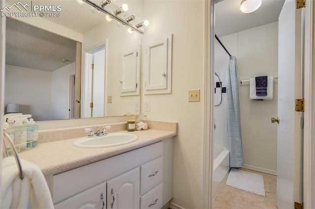 full bath featuring vanity, shower / tub combo, and a textured ceiling