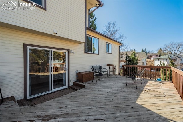 wooden deck with a residential view