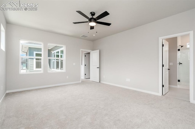 unfurnished bedroom with visible vents, baseboards, light colored carpet, ensuite bath, and a ceiling fan