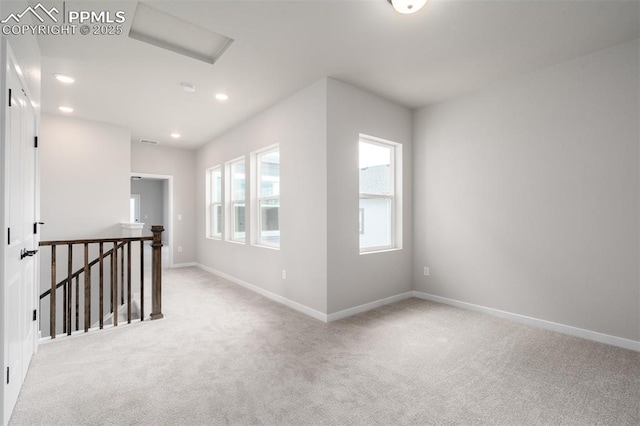 carpeted empty room with visible vents, recessed lighting, and baseboards