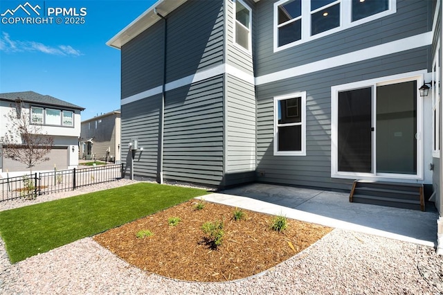 exterior space with a patio area, a yard, and fence