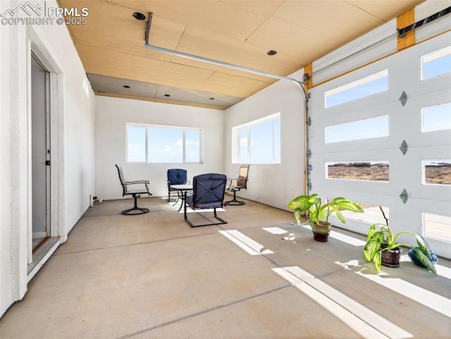 sunroom featuring wooden ceiling