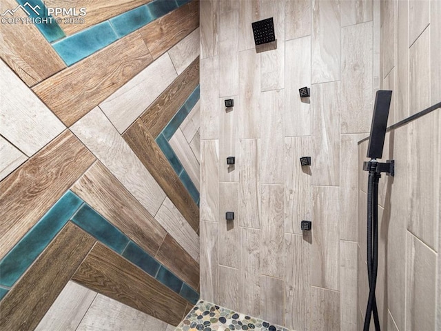 full bath featuring a tile shower