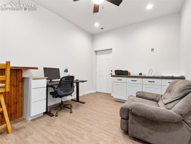 office space featuring a ceiling fan, recessed lighting, light wood-style floors, and visible vents