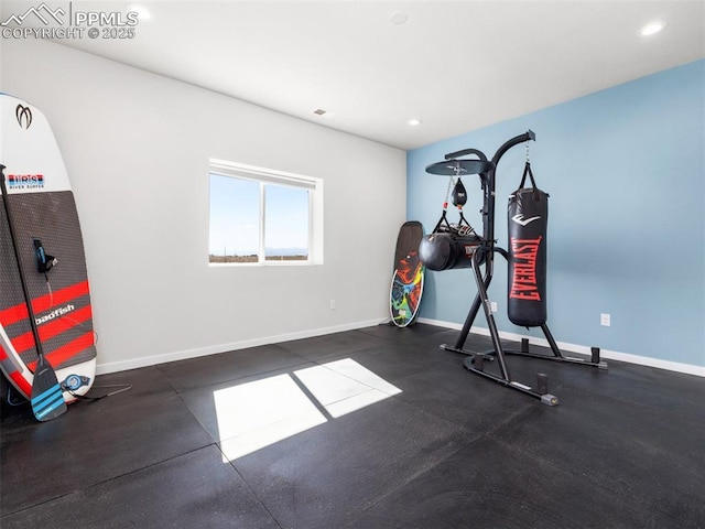 exercise room featuring recessed lighting and baseboards