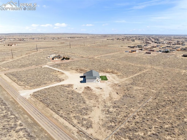 drone / aerial view with a rural view and a desert view