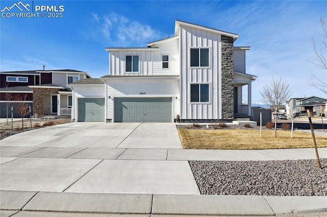 view of front facade with board and batten siding, concrete driveway, and a garage