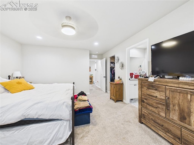 bedroom featuring recessed lighting, light colored carpet, and baseboards