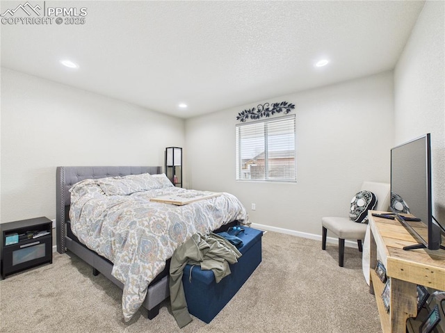 carpeted bedroom with recessed lighting, a textured ceiling, and baseboards