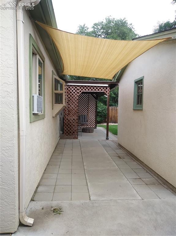 view of patio featuring fence