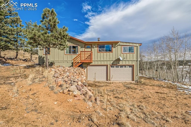 view of front of house featuring board and batten siding and an attached garage