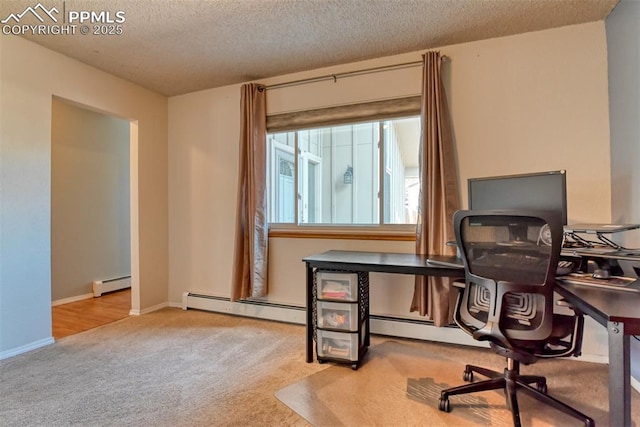 carpeted office space featuring a baseboard radiator, baseboards, and a textured ceiling
