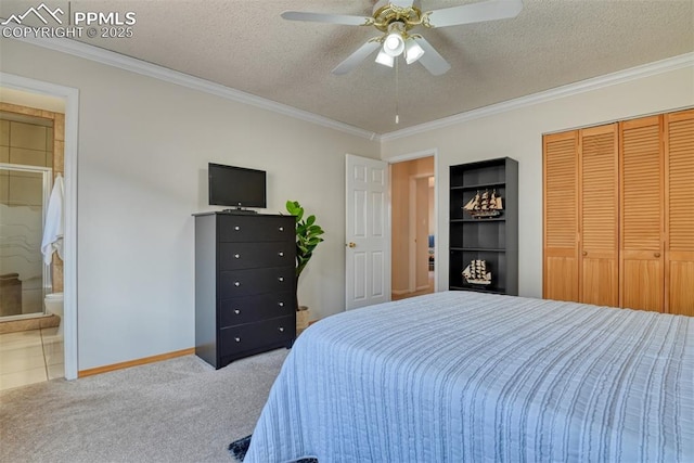 bedroom featuring connected bathroom, a closet, crown molding, carpet floors, and a textured ceiling