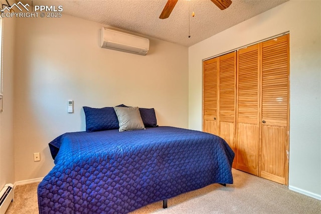 bedroom featuring light carpet, an AC wall unit, a baseboard heating unit, and a textured ceiling