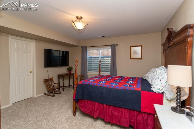 bedroom featuring visible vents, light carpet, and baseboards