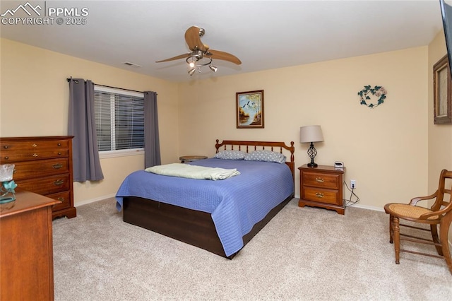 bedroom with a ceiling fan, baseboards, visible vents, and carpet floors