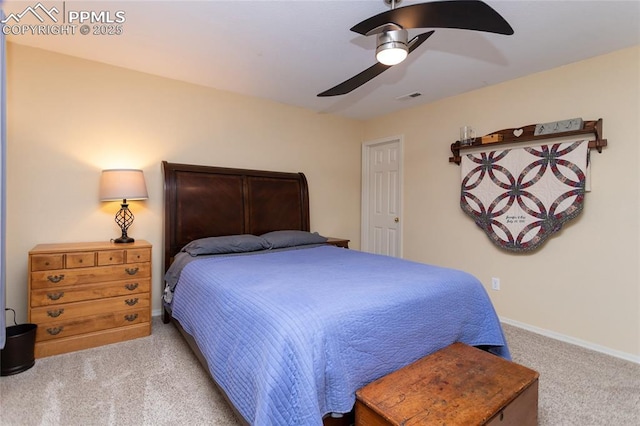 bedroom with visible vents, carpet flooring, baseboards, and ceiling fan