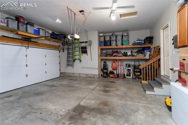 garage with a ceiling fan and a garage door opener