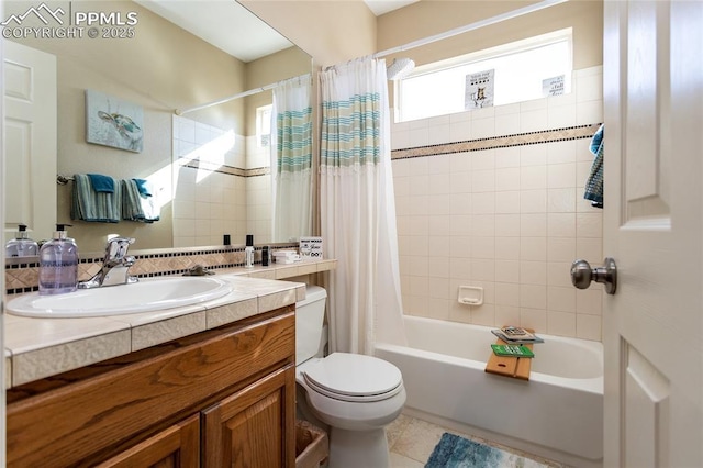 bathroom with tile patterned flooring, toilet, vanity, and shower / bath combo