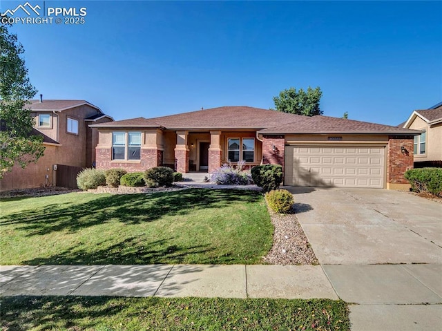 view of front of property featuring brick siding, a garage, driveway, and a front lawn