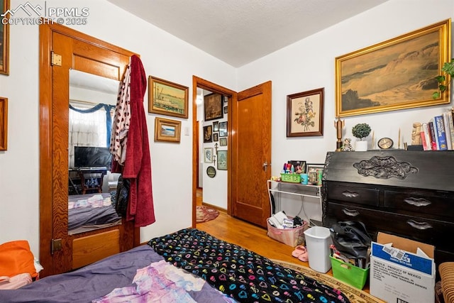 bedroom featuring wood finished floors