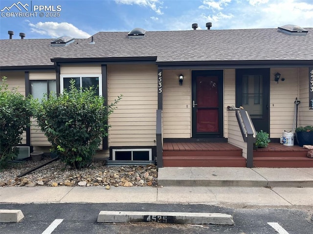 4535 Lamplighter Cir, Colorado Springs, CO 80916 - view of front of home with a porch and a shingled roof