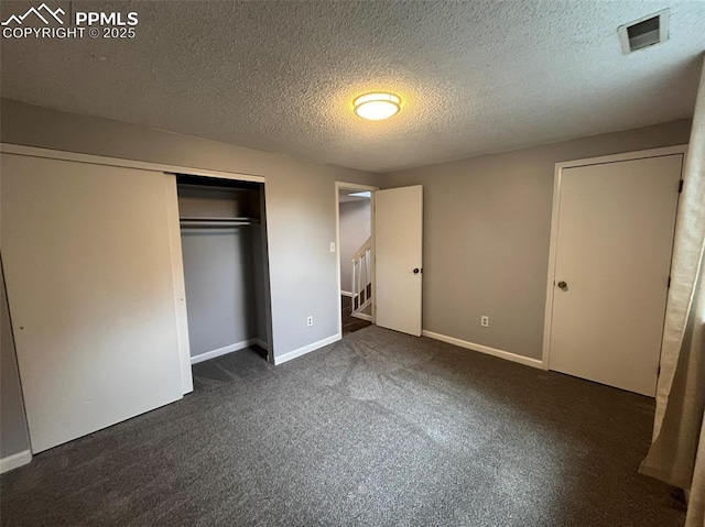 4535 Lamplighter Cir, Colorado Springs, CO 80916 - unfurnished bedroom with a closet, carpet flooring, a textured ceiling, baseboards, and visible vents