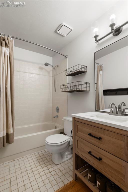 full bathroom featuring tile patterned flooring, visible vents, toilet, shower / bath combination with curtain, and vanity