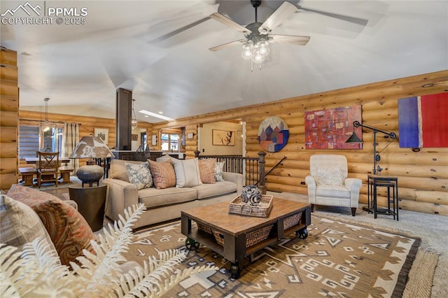 carpeted living room featuring ornate columns and ceiling fan