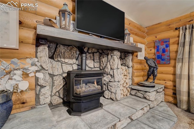 details with log walls and a wood stove