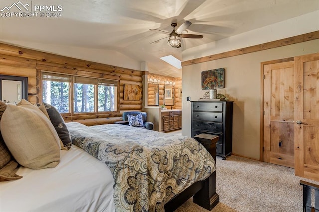 carpeted bedroom featuring ceiling fan, vaulted ceiling, connected bathroom, and log walls