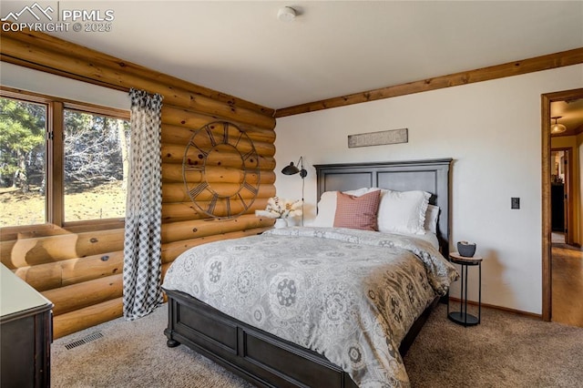 bedroom featuring carpet flooring, baseboards, visible vents, and log walls