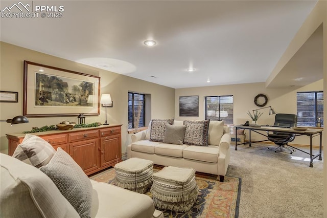 living area featuring recessed lighting and light carpet