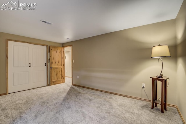 interior space featuring baseboards and visible vents