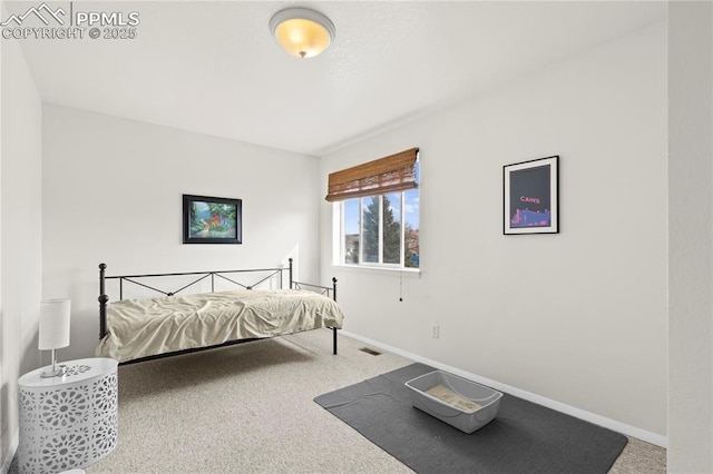 carpeted bedroom with baseboards