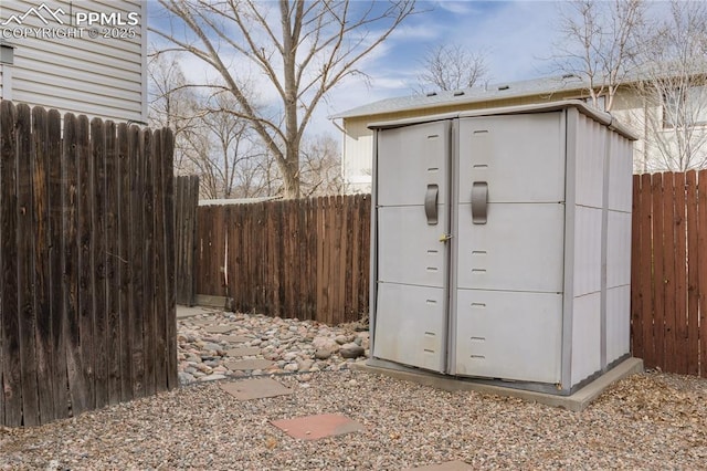 view of shed featuring a fenced backyard