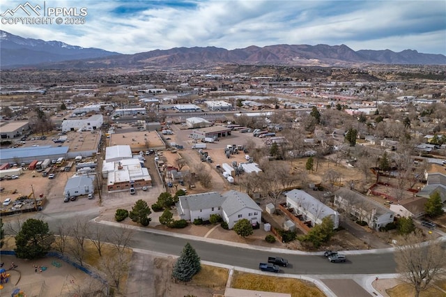 birds eye view of property with a mountain view