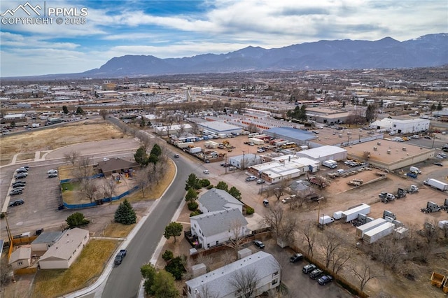 birds eye view of property featuring a mountain view