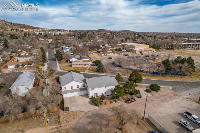 drone / aerial view featuring a mountain view and a residential view