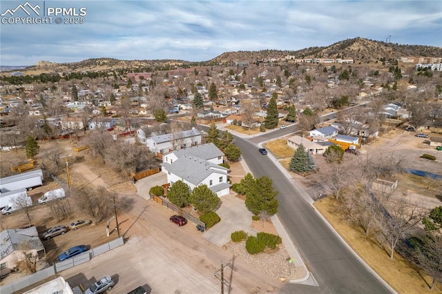 drone / aerial view featuring a mountain view and a residential view