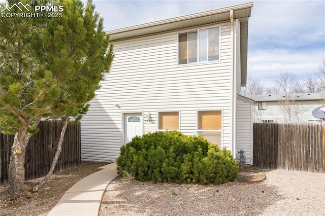 view of front of home with fence