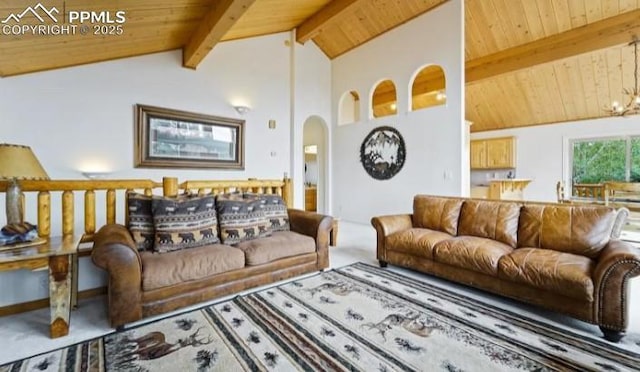 carpeted living area with wooden ceiling, beamed ceiling, a notable chandelier, and arched walkways